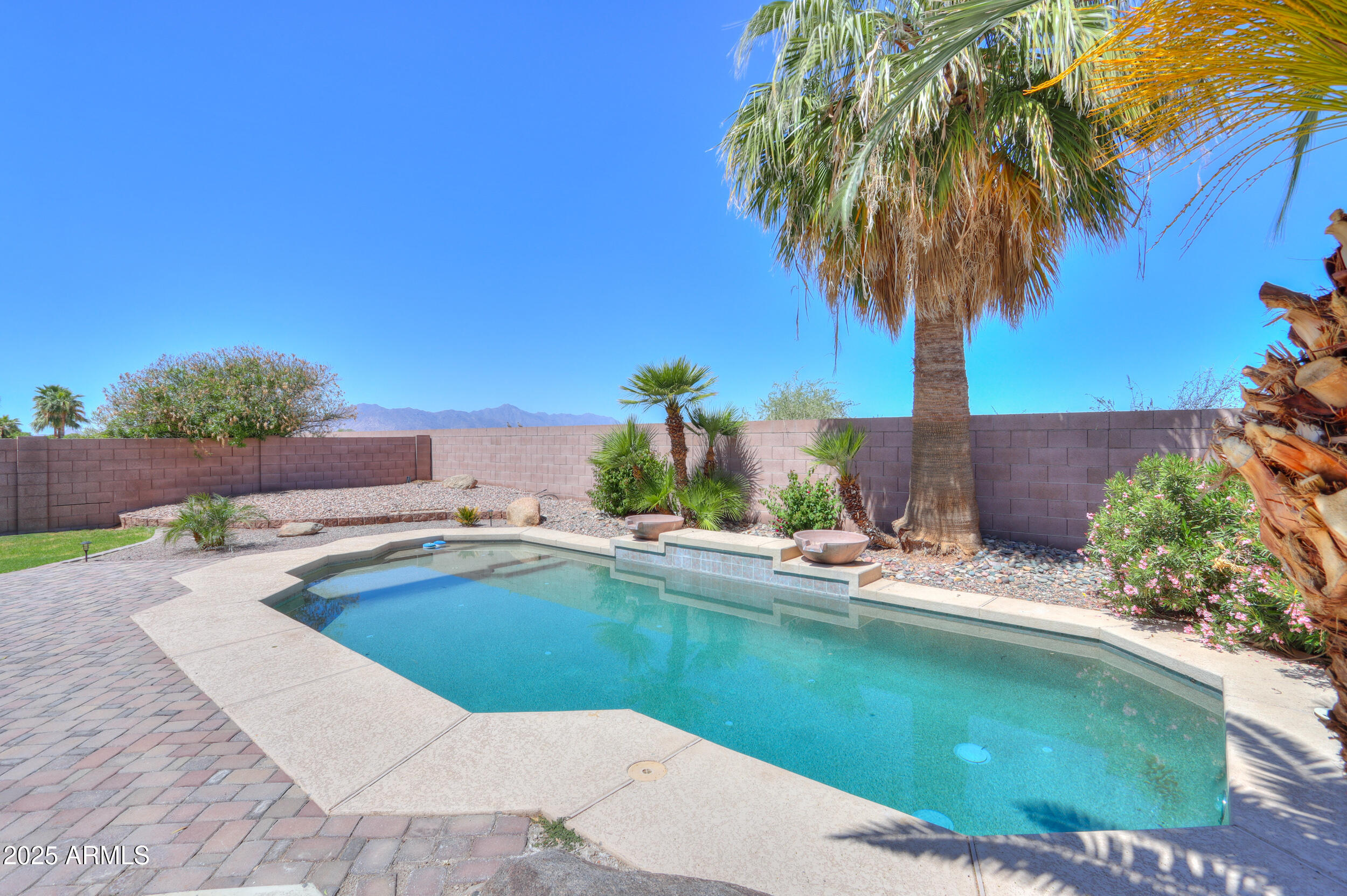 44254 Adobe Circle Maricopa, AZ 85139 - Photo 53 of 71 a view of a swimming pool with a yard