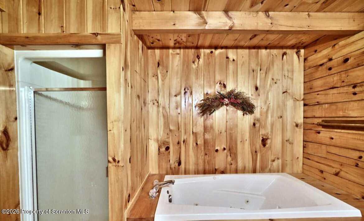 9 East Lake Road Moscow, PA 18444 - Photo 22 of 48 a bathroom with a bathtub and a shower