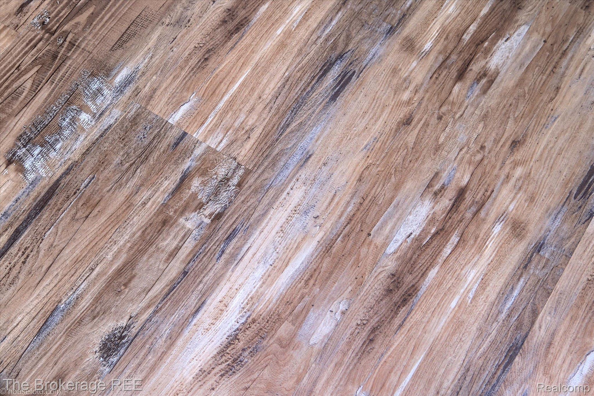 4432 North Belsay Road Flint, MI 48506 - Photo 42 of 79 Wood-finish flooring planks with varied grain patterns and a distressed aesthetic
