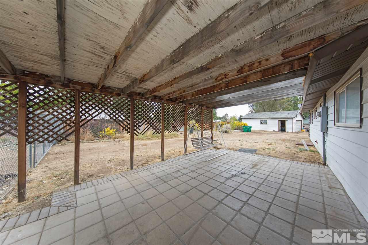 9055 Reservoir Street Reno, NV 89506 - Photo 4 of 15 a view of a room with wooden walls