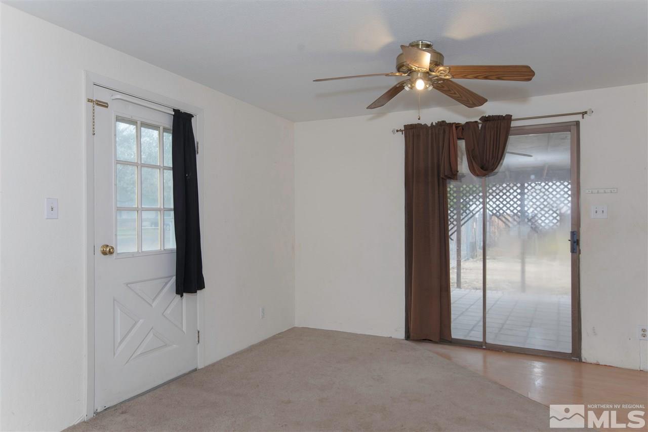 9055 Reservoir Street Reno, NV 89506 - Photo 6 of 15 a view of a livingroom with a ceiling fan and wooden floor