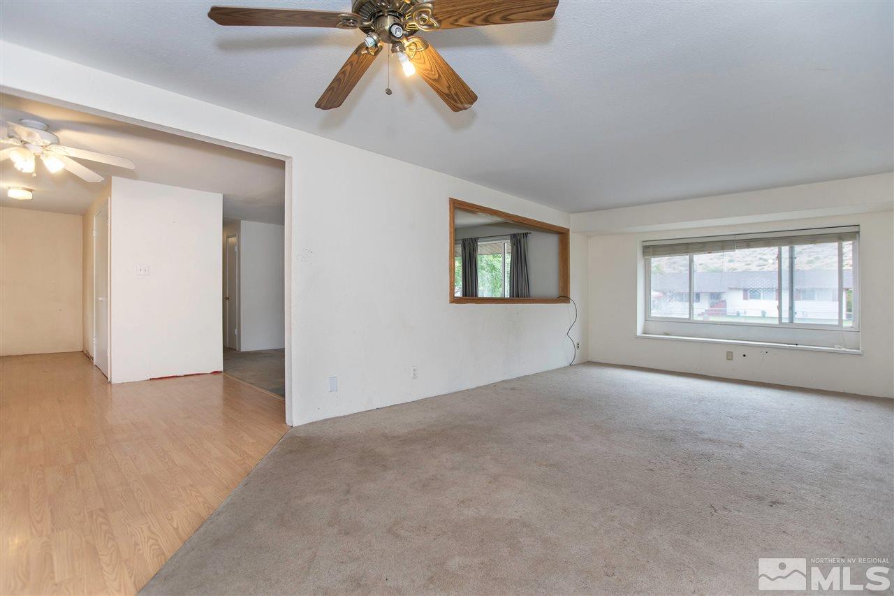 9055 Reservoir Street Reno, NV 89506 - Photo 8 of 15 an empty room with windows and fan