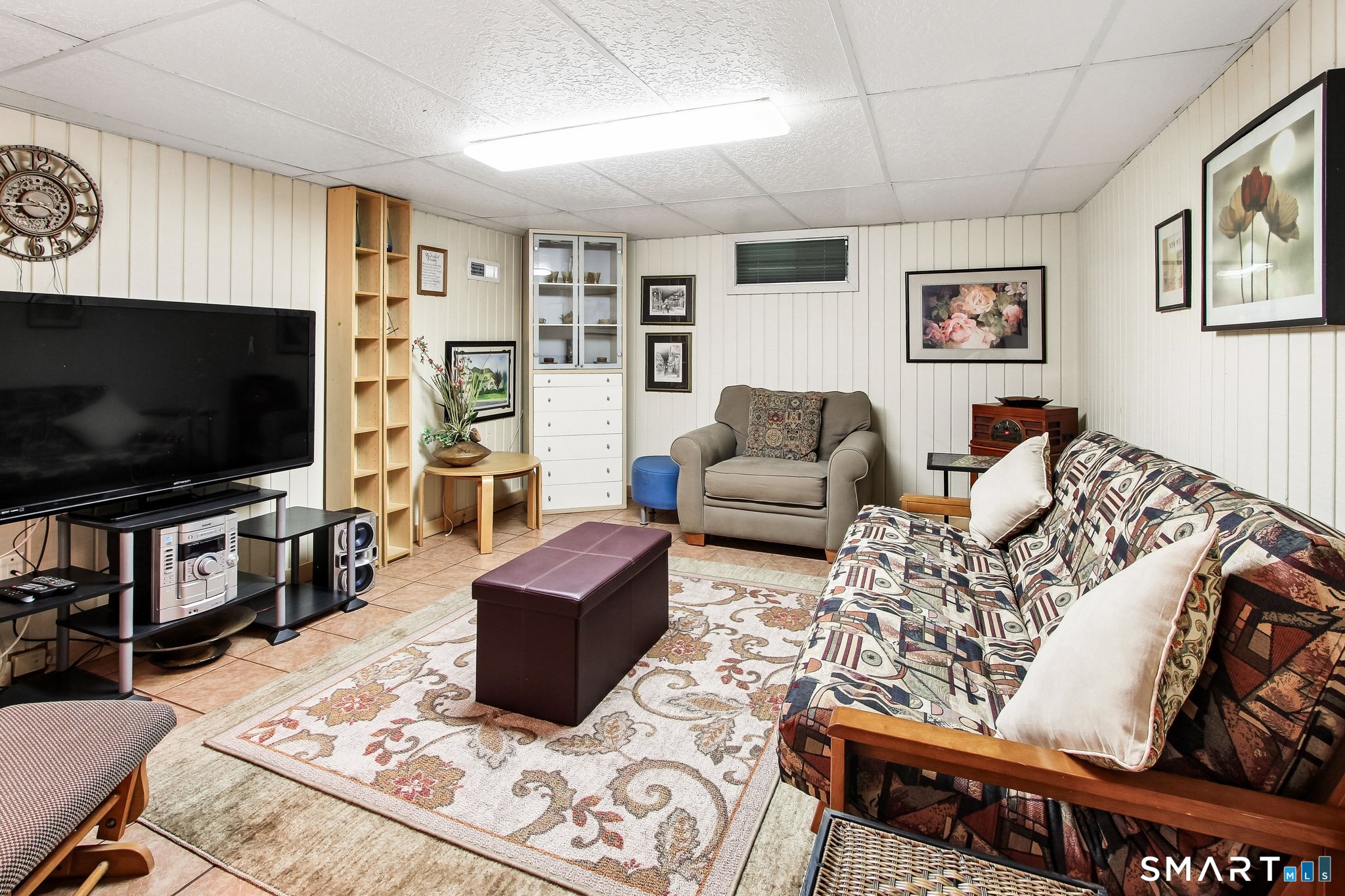 60 Clintonville Road, Unit 103 North Branford, CT 06472 - Photo 32 of 40 Lower level family room is perfect for streaming your favorite shows or invite your guests to stay.
