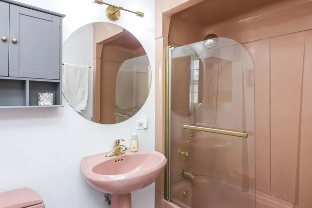 a bathroom with a sink and mirror