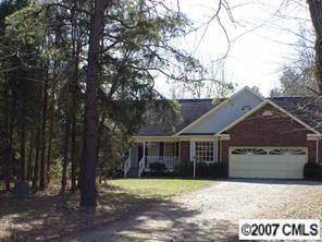 16832 Plaincrest Road Midland, NC 28107 - Photo 1 of 8 a front view of a house with a yard and garage