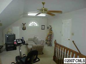 16832 Plaincrest Road Midland, NC 28107 - Photo 7 of 8 a view of a room with furniture and chandelier