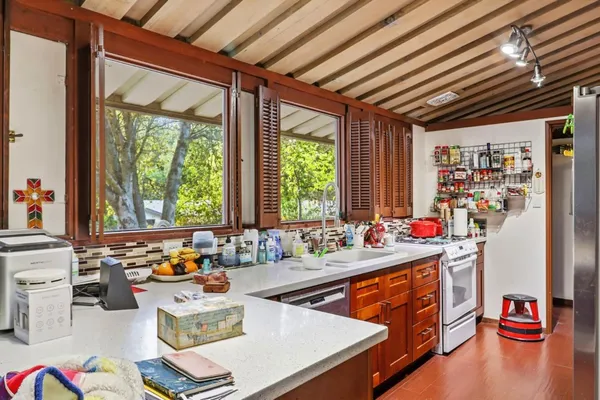 a very nice looking dining room with a large window