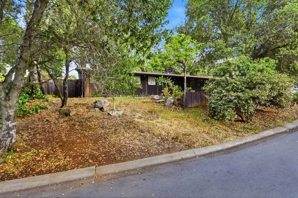 a house with trees in front of it