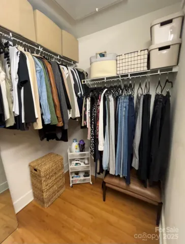 a bedroom with a bed and a night stand