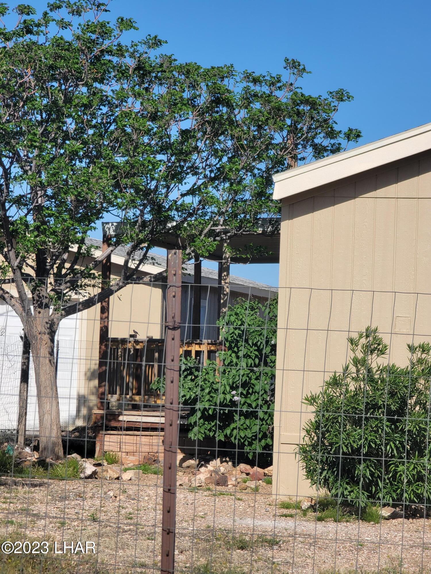 4944 Elgin Road Golden Valley, AZ 86413 - Photo 3 of 14 a view of a entrance gate of the house