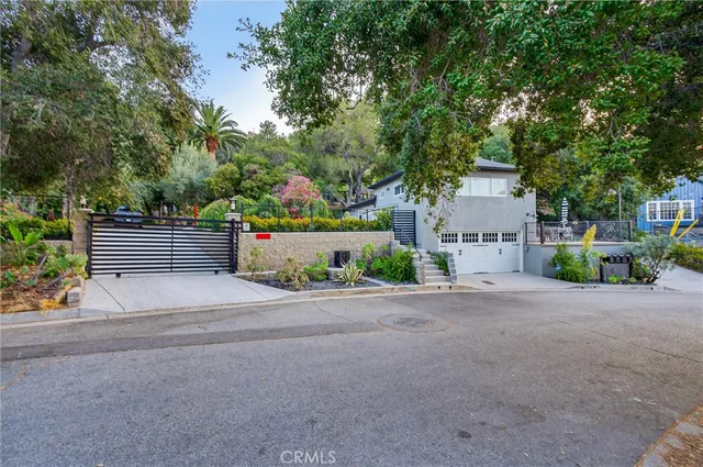 a front view of a house with a yard and a garage