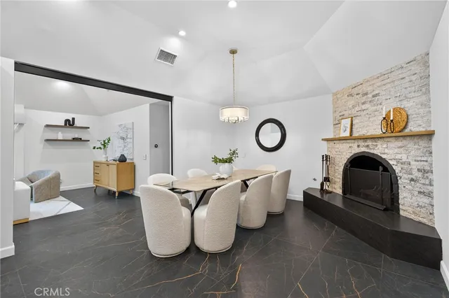 a living room with furniture and a clock