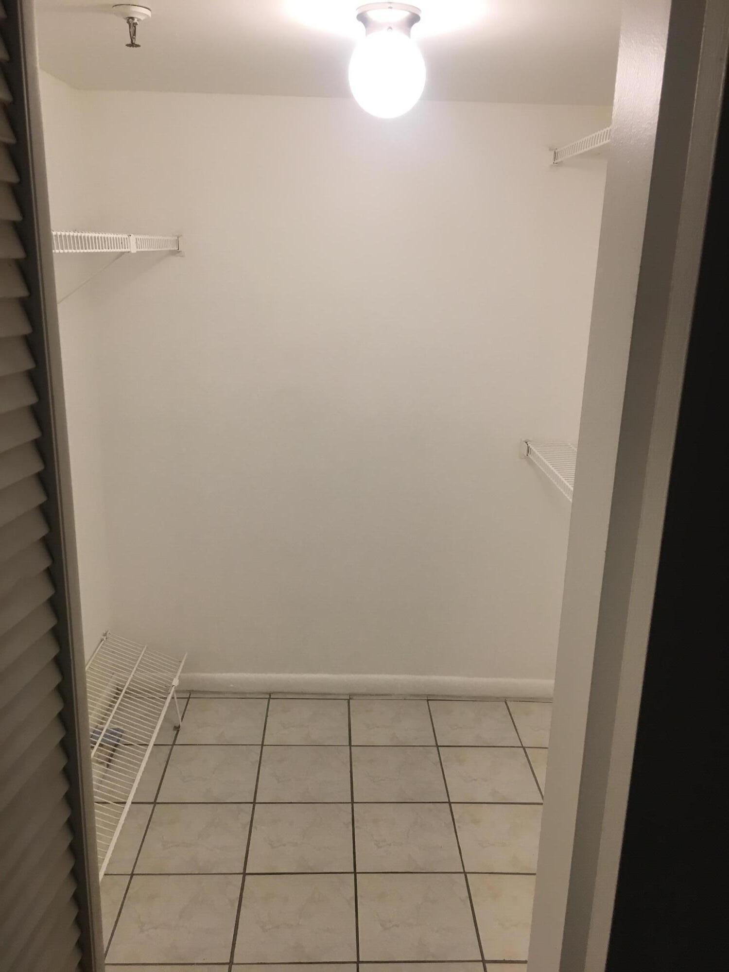 5280 Northwest 2nd Avenue, Unit 213 Boca Raton, FL 33487 - Photo 5 of 17 5280 213 walk-in closet