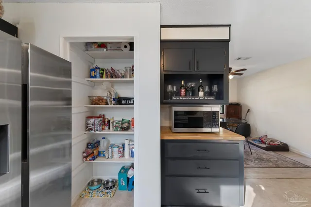 a kitchen with a cabinets and a fireplace