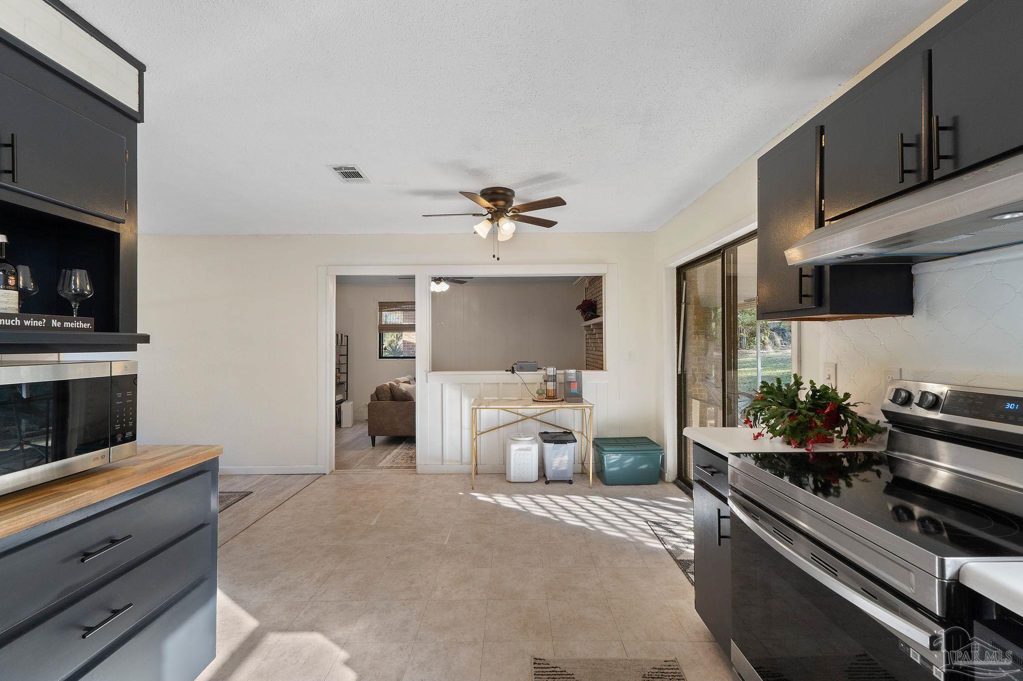 465 Ronda Street Pensacola, FL 32534 - Photo 12 of 48 a living room with furniture and a flat screen tv