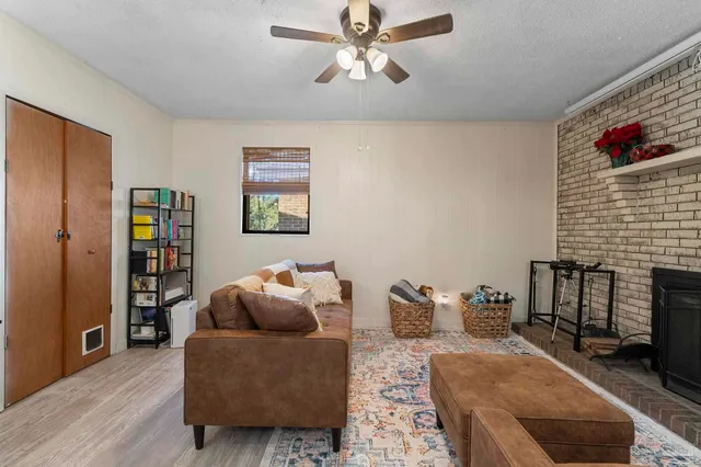 a living room with furniture and a fireplace
