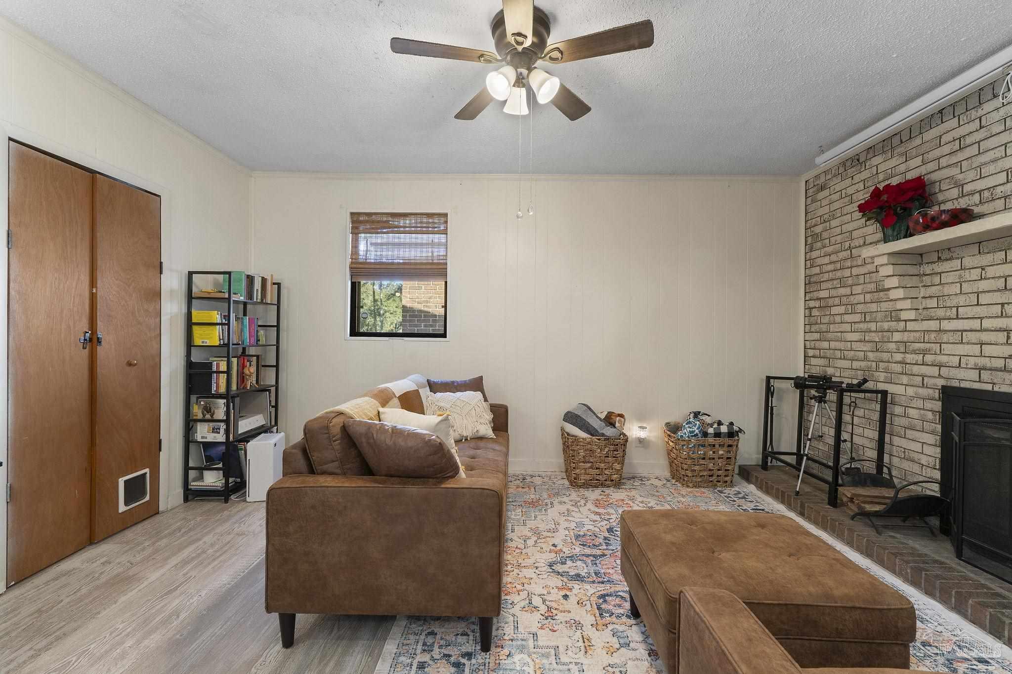 465 Ronda Street Pensacola, FL 32534 - Photo 16 of 48 a living room with furniture and a fireplace
