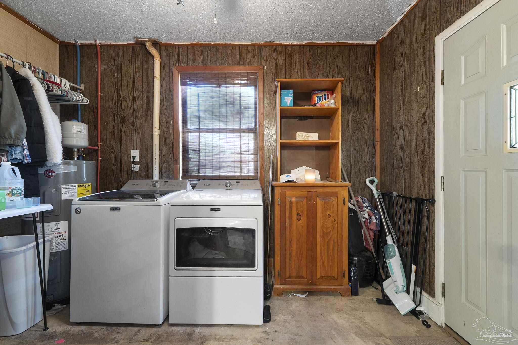 465 Ronda Street Pensacola, FL 32534 - Photo 26 of 48 a view of a storage and utility room with washer and dryer