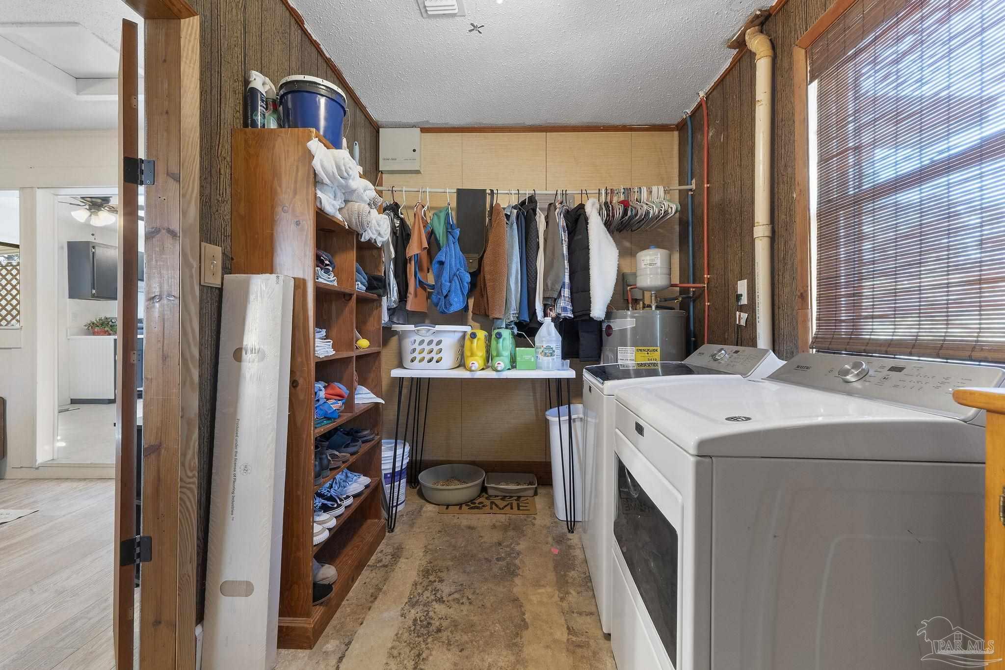 465 Ronda Street Pensacola, FL 32534 - Photo 27 of 48 a view of walk in closet with clothes and shoes