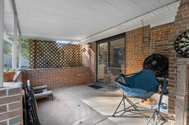 a patio with table and chairs