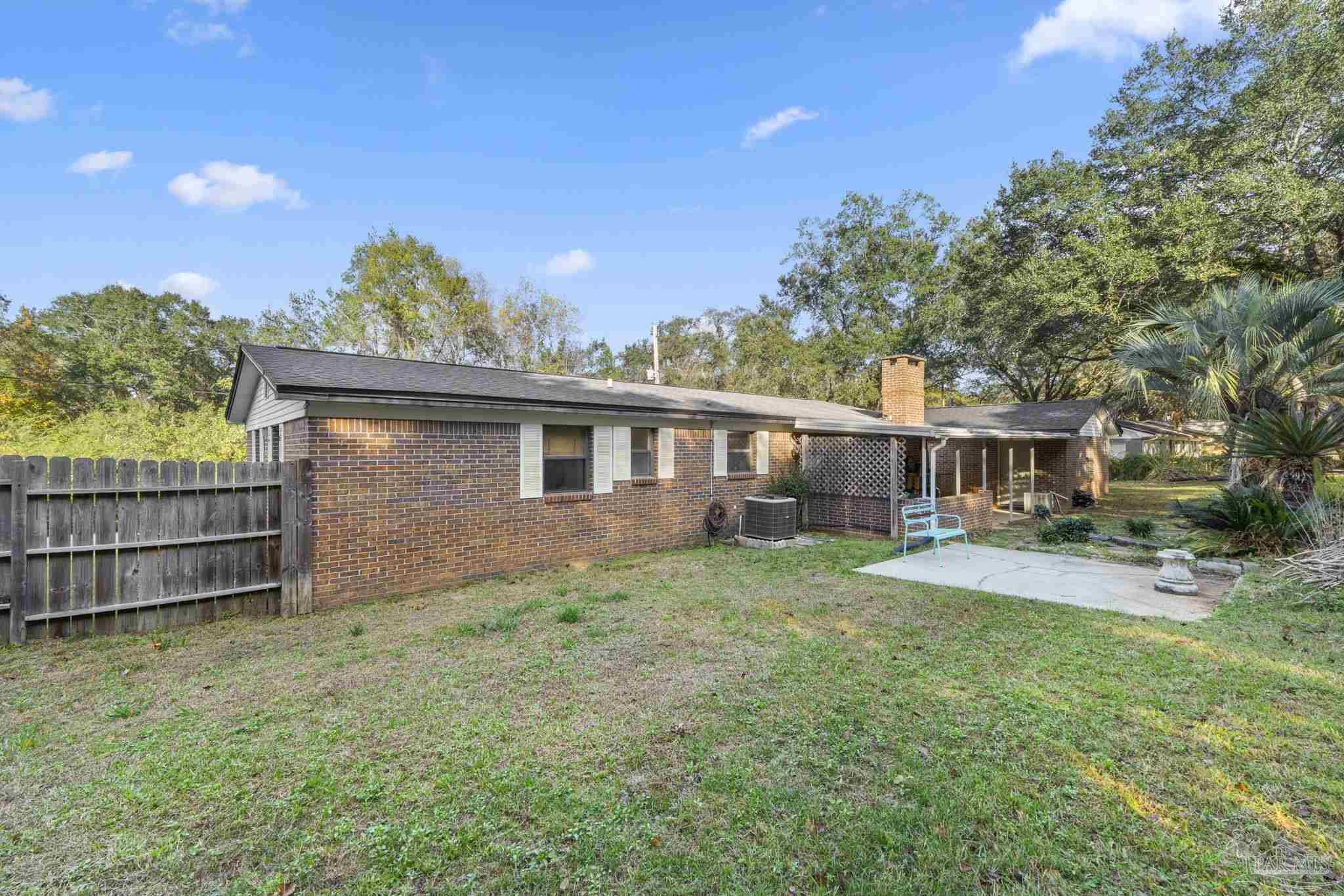 465 Ronda Street Pensacola, FL 32534 - Photo 34 of 48 a view of a house with a yard and sitting area