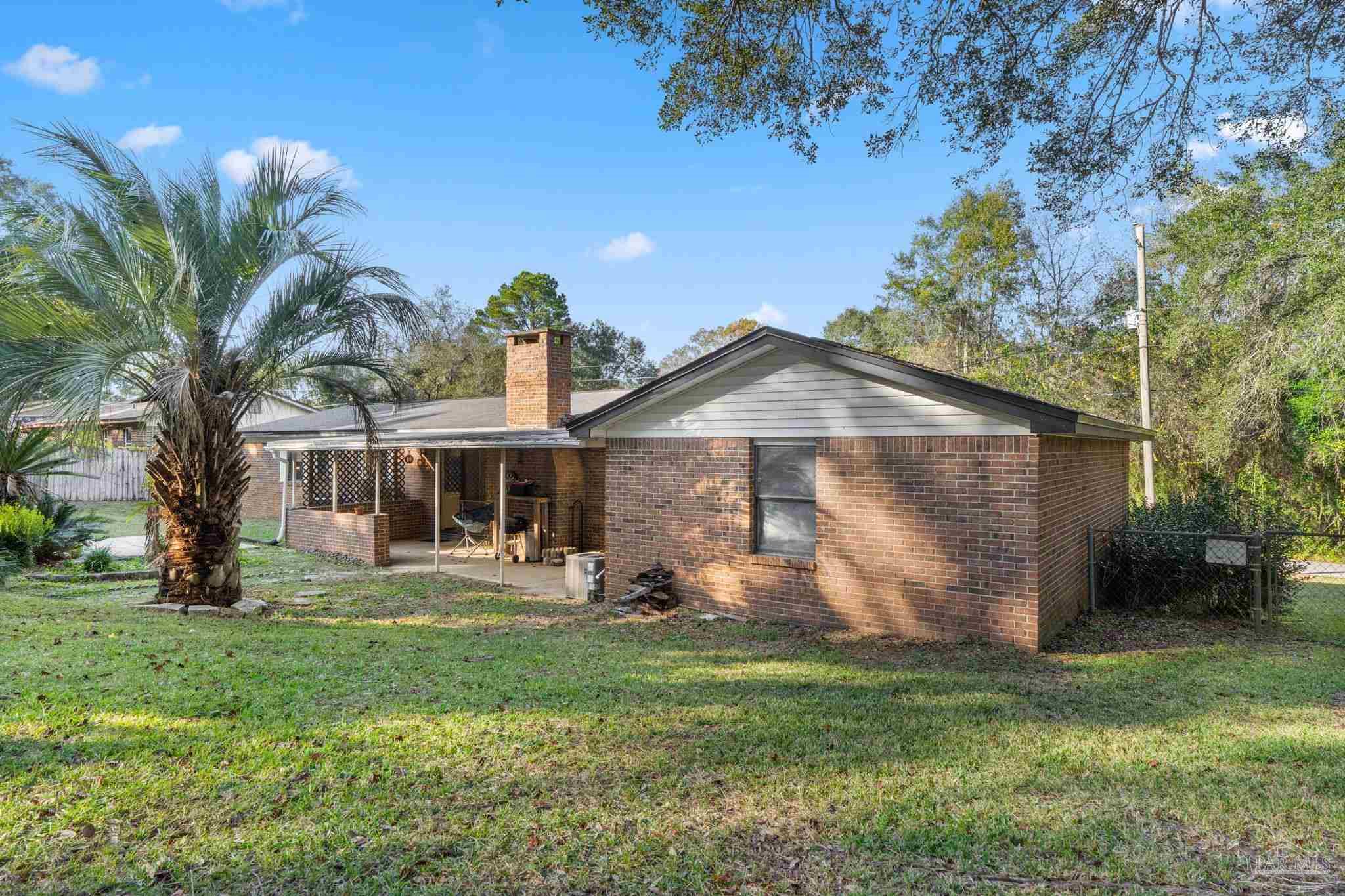 465 Ronda Street Pensacola, FL 32534 - Photo 36 of 48 a front view of house with yard and outdoor seating