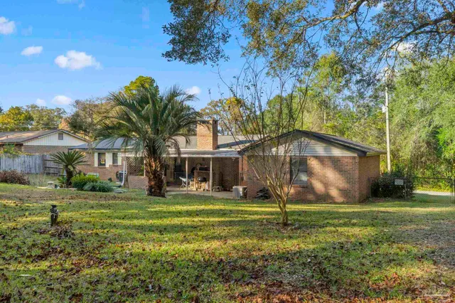 a house that has tree in front of it