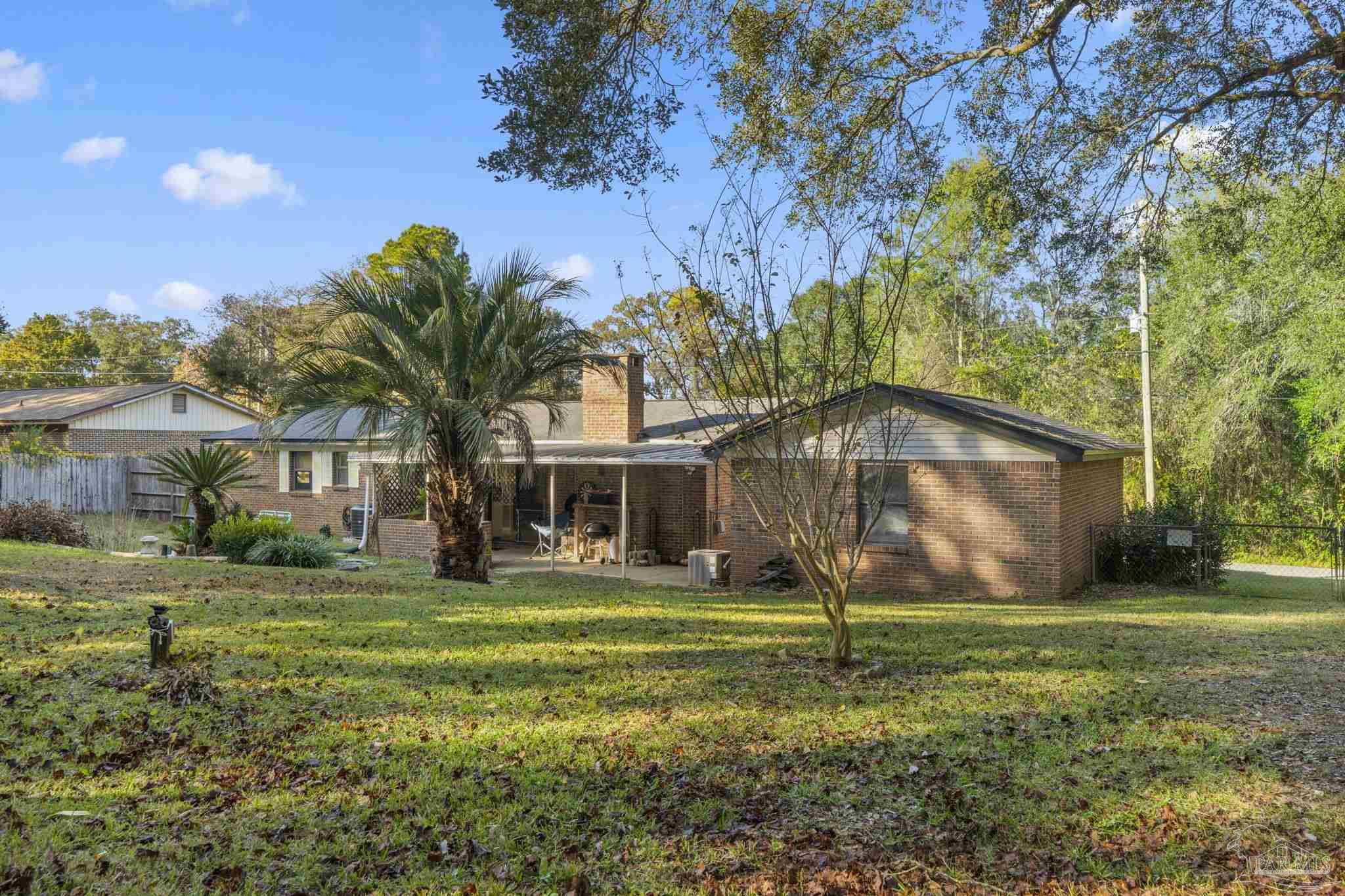 465 Ronda Street Pensacola, FL 32534 - Photo 39 of 48 a view of a house with a yard