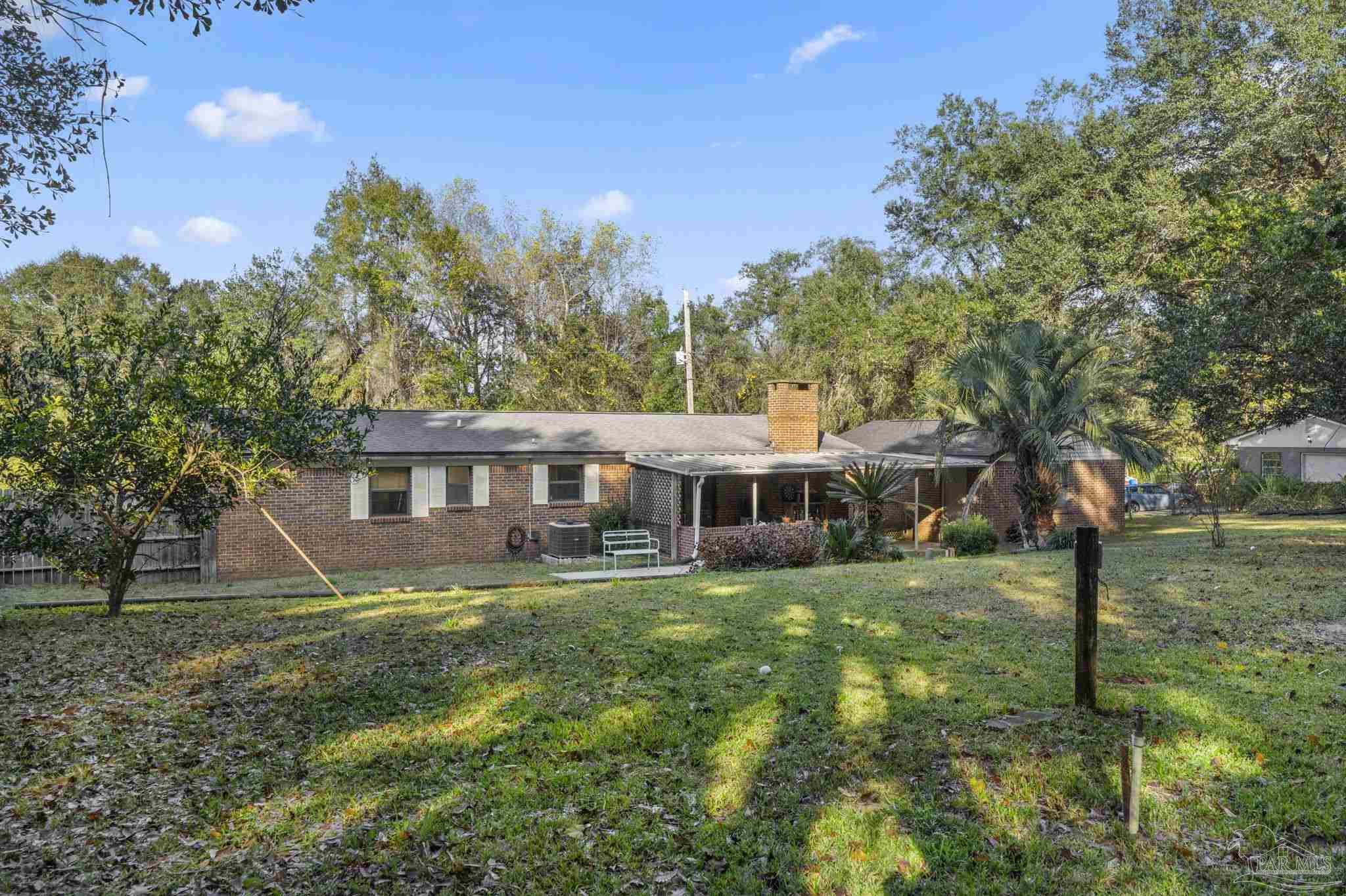 465 Ronda Street Pensacola, FL 32534 - Photo 40 of 48 a house that has tree in front of it