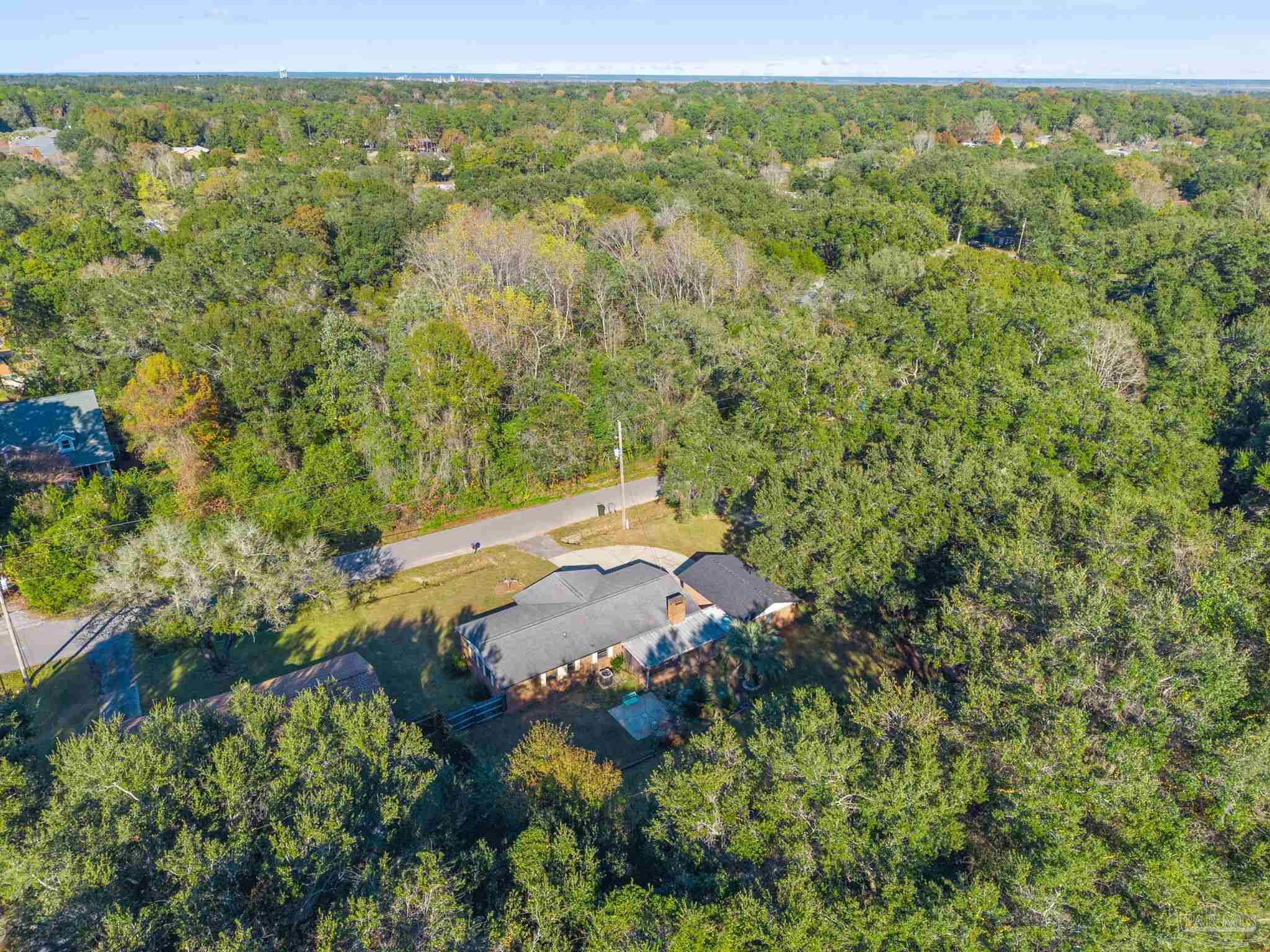 465 Ronda Street Pensacola, FL 32534 - Photo 41 of 48 a view of a lush green field with lots of trees
