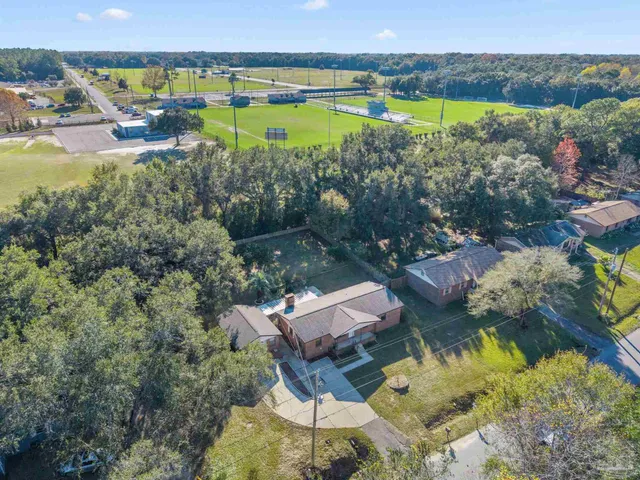 an aerial view of a house with a lake view