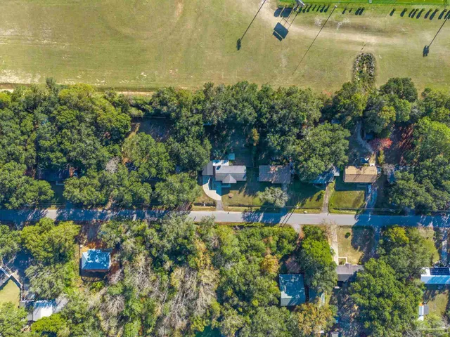 an aerial view of a house with a lake view