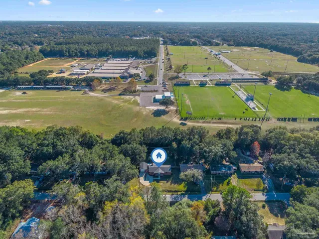 an aerial view of a house with a lake view