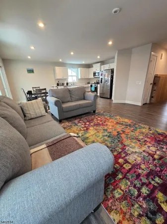 a living room with furniture and a rug
