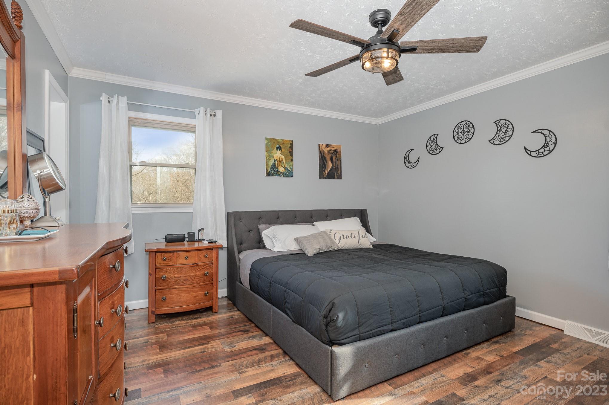 835 Parks Road Woodleaf, NC 27054 - Photo 12 of 28 a bedroom with a bed dresser and a window
