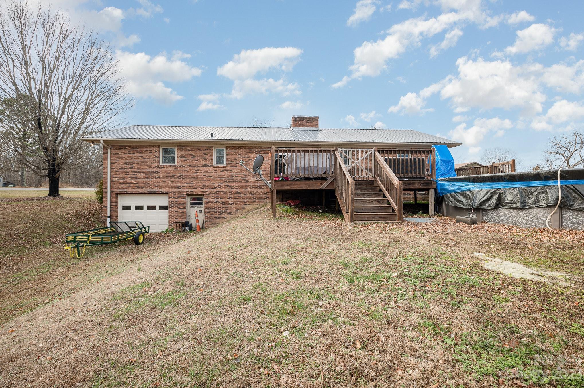 835 Parks Road Woodleaf, NC 27054 - Photo 24 of 28 a view of a house with backyard