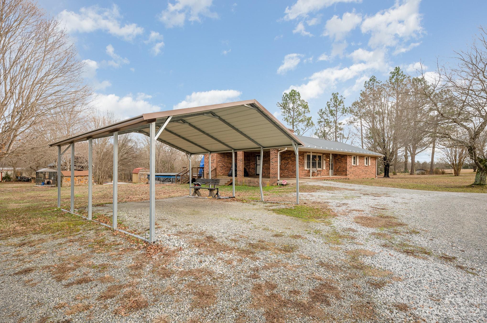 835 Parks Road Woodleaf, NC 27054 - Photo 28 of 28 a view of a house with a yard and wooden fence