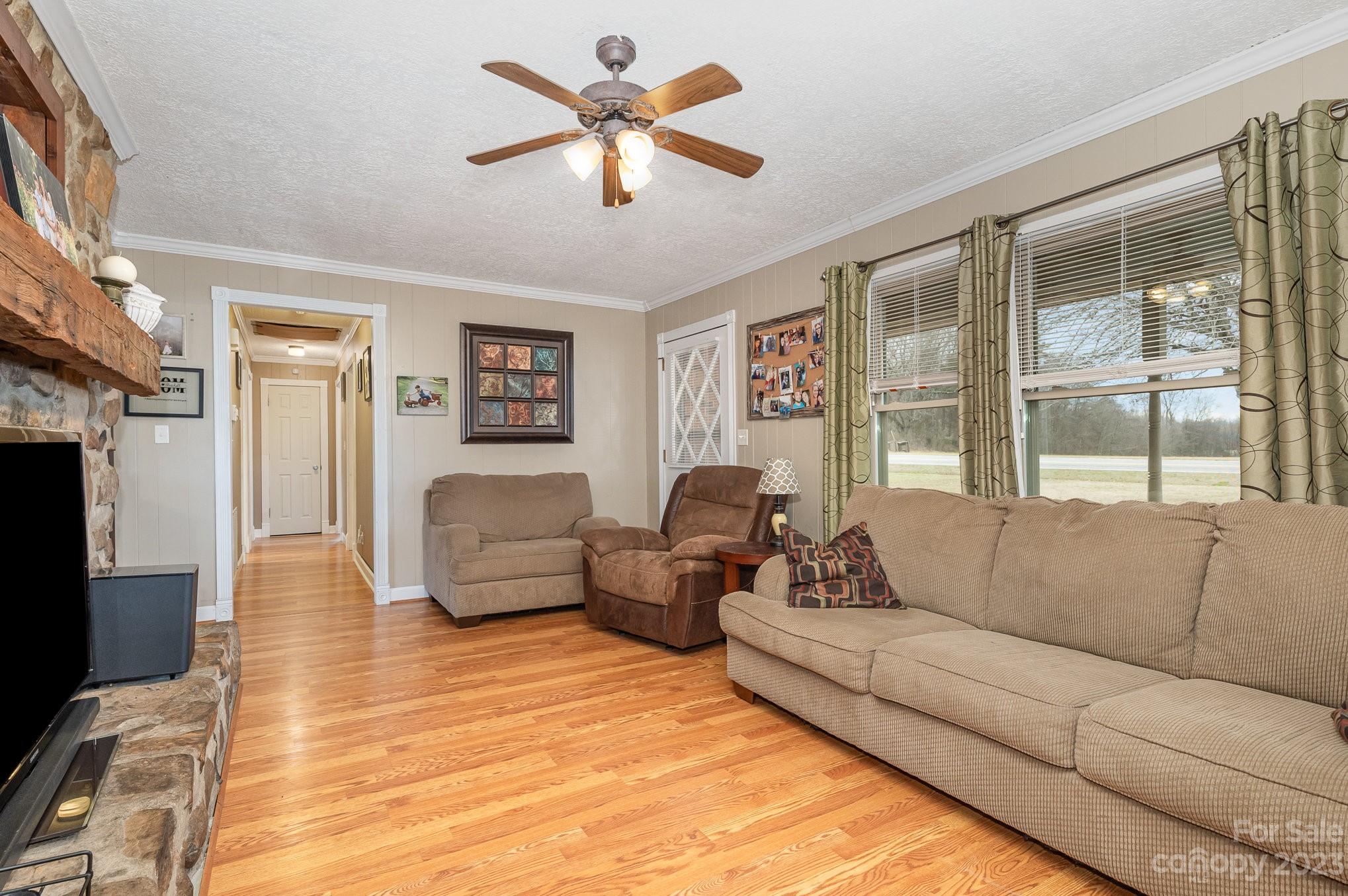 835 Parks Road Woodleaf, NC 27054 - Photo 5 of 28 a living room with furniture and a flat screen tv