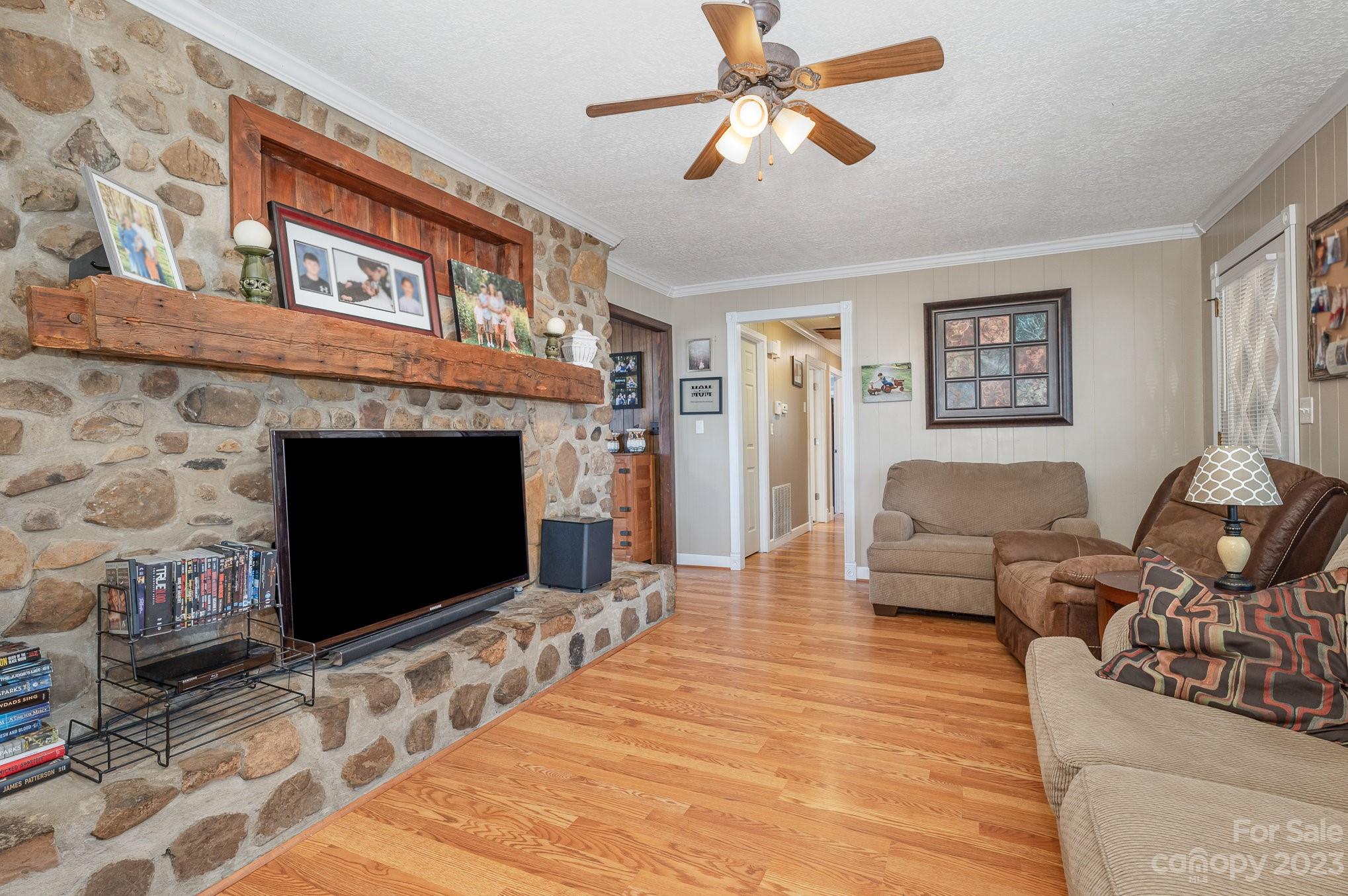 835 Parks Road Woodleaf, NC 27054 - Photo 7 of 28 a living room with furniture and a fireplace
