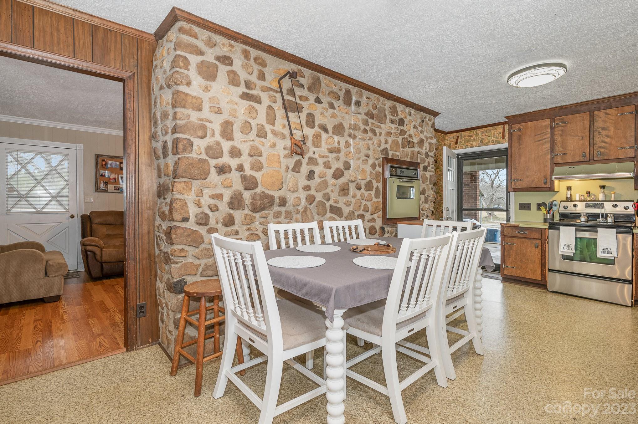 835 Parks Road Woodleaf, NC 27054 - Photo 9 of 28 a dining room with furniture and wooden floor