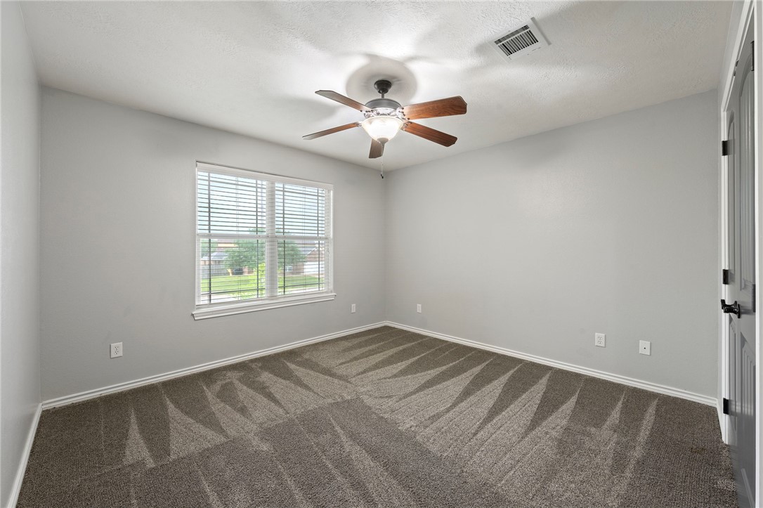 3304 Keefer Loop College Station, TX 77845 - Photo 14 of 21 an empty room with windows and fan