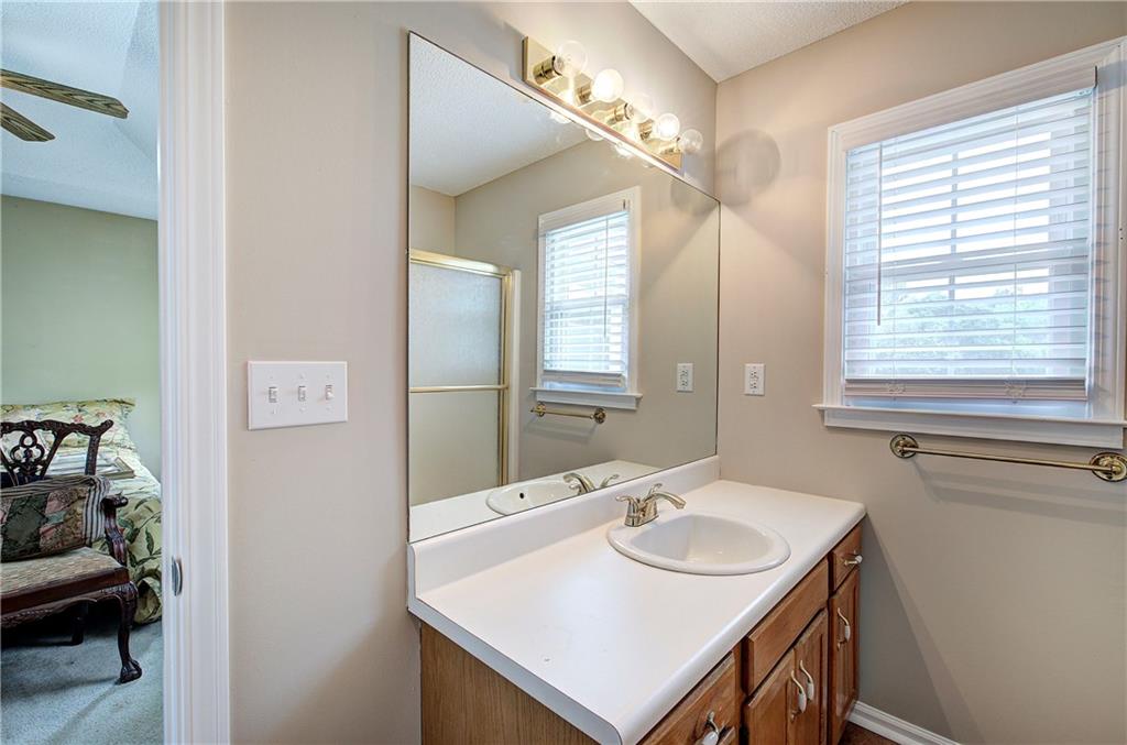 218 Gilreath Road Southeast Cartersville, GA 30121 - Photo 17 of 27 a bathroom with a sink and a mirror