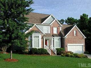 2601 Trickle Court Raleigh, NC 27615 - Photo 1 of 1 a front view of a house with a yard