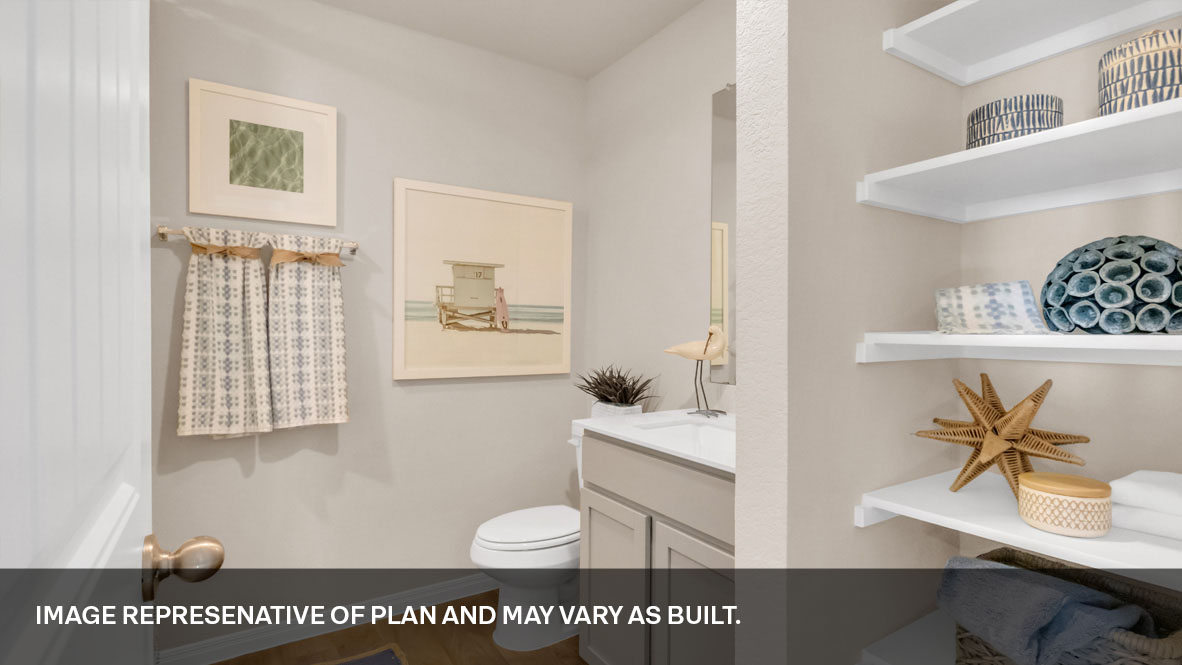 118 Morning Glory Loop Kyle, TX 78640 - Photo 28 of 32 a bathroom with a sink a toilet and a mirror