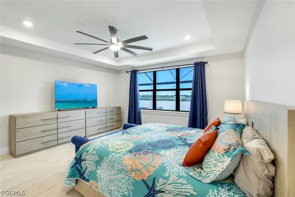 a bedroom with a large bed and a window