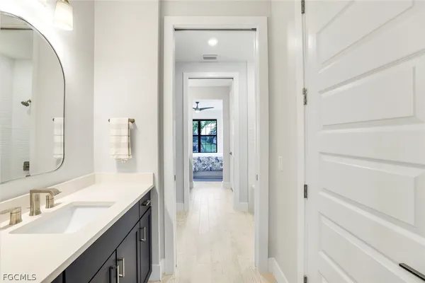 a en suite bathroom with a sink and a mirror