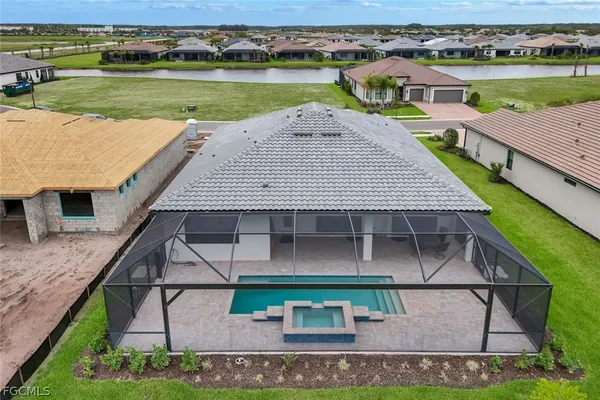 an aerial view of a house with outdoor space