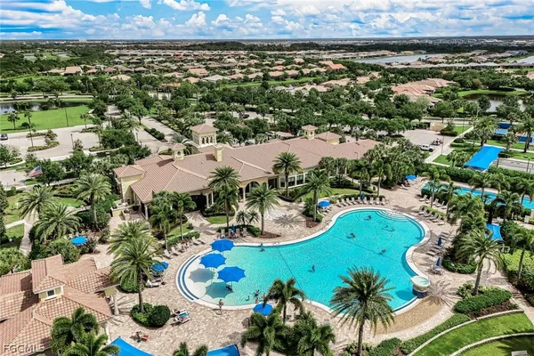 an aerial view of a house with a swimming pool