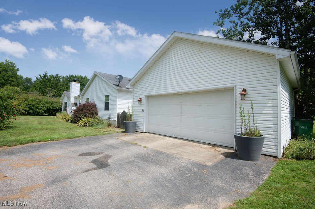 4594 Center Road Andover, OH 44003 - Photo 39 of 39 View of front of house with a front yard and asphalt driveway