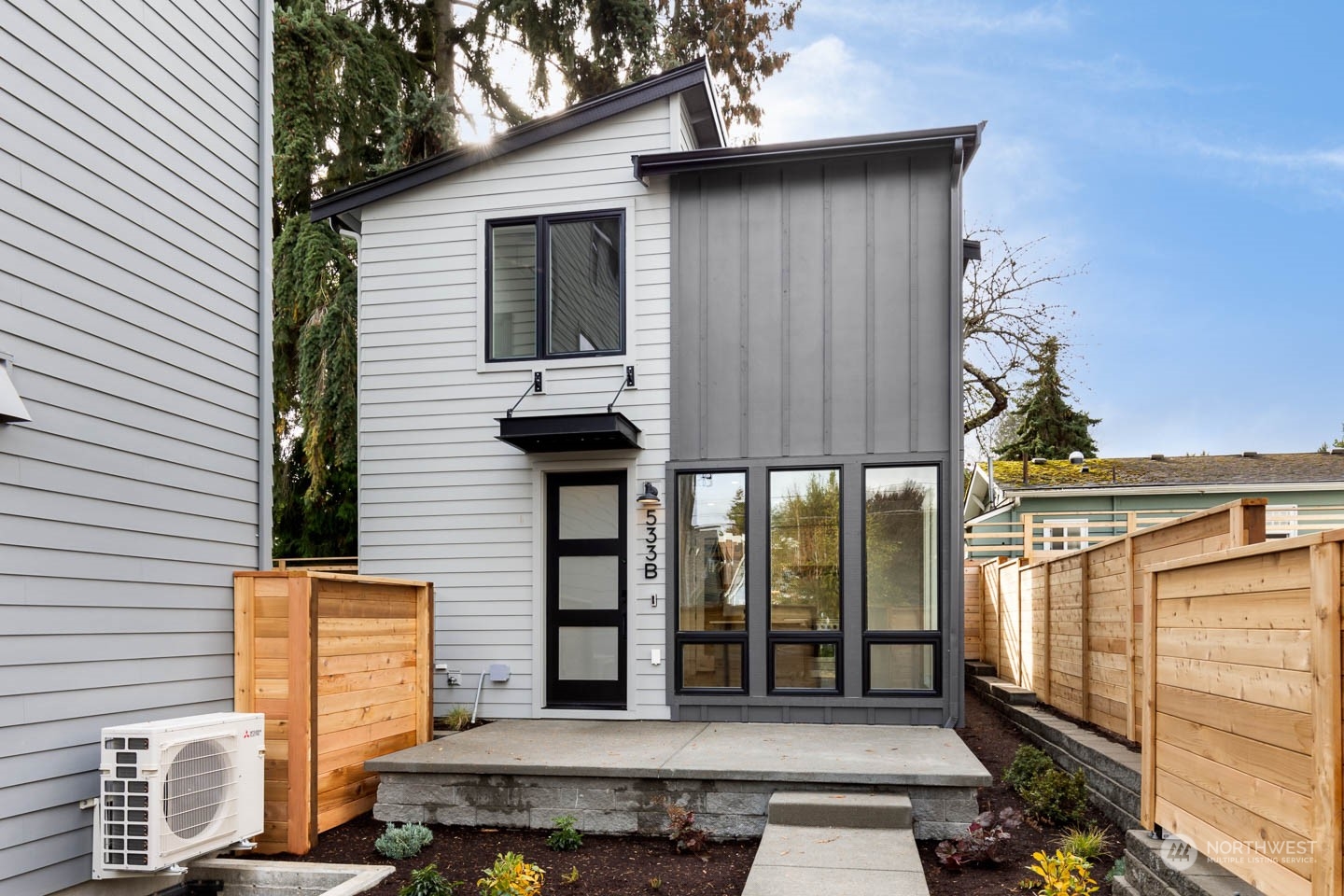 a front view of a house with glass windows